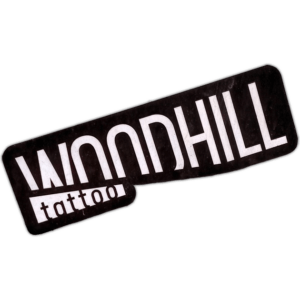 Woodhill tattoo sticker spotted in Prague in 2026