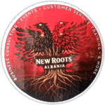 New Roots Albania sticker spotted in Tirana in 2026.