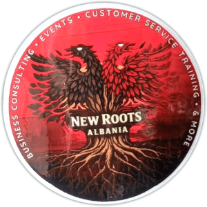 New Roots Albania sticker spotted in Tirana in 2026.