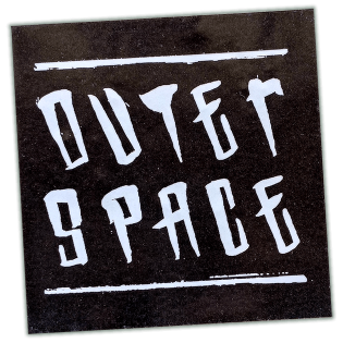 Outer Space wanted sticker spotted in Prague in 2026