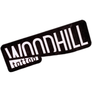 Woodhill tattoo sticker spotted in Prague in 2026