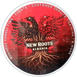 New Roots Albania sticker spotted in Tirana in 2026.
